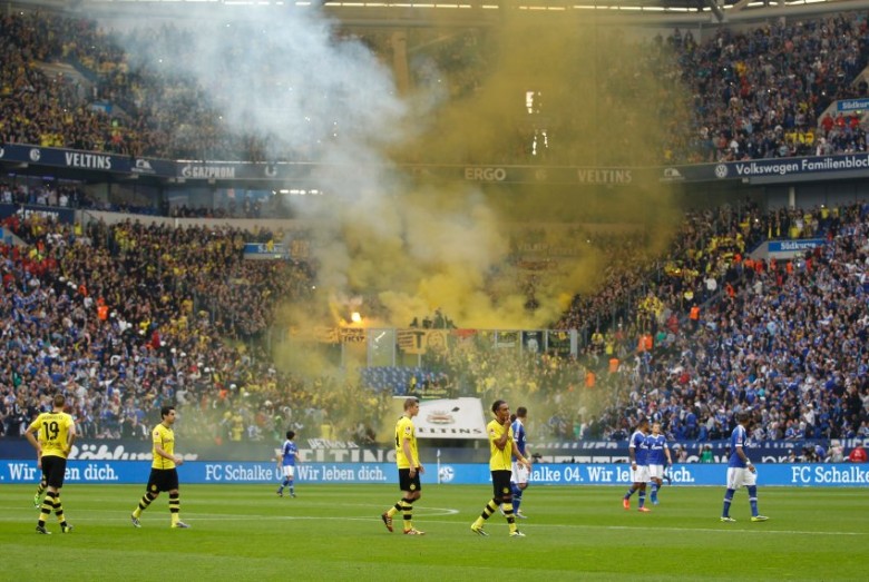 Referee Knut Kircher stops the German first division Bundesliga soccer match between Borussia Dortmund and Schalke 04  in Gelsenkirchen