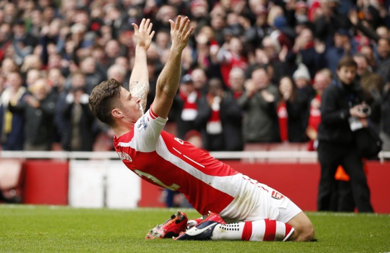 Giroud celebrates scoring a magnificent goal against Liverpool