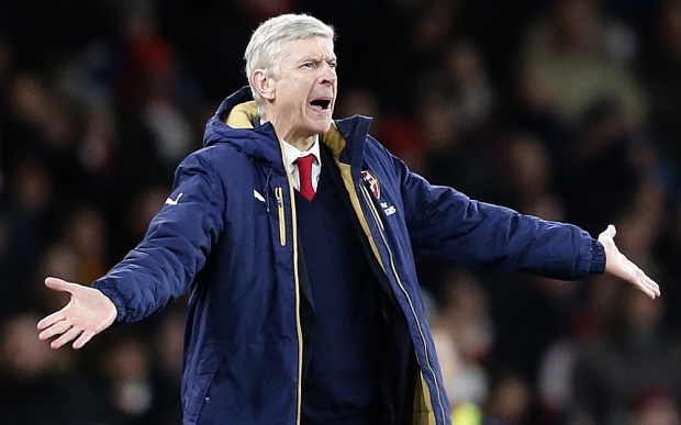 Arsenal's manager Arsene Wenger gestures during the English Premier League soccer match between Arsenal and Swansea City at the Emirates stadium in London, Wednesday, March 2, 2016.(AP Photo/Frank Augstein)