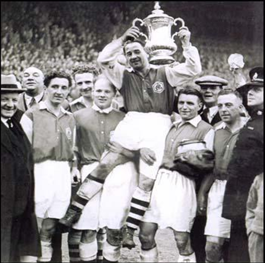 Alex James in happier times: holding the 1936 FA Cup