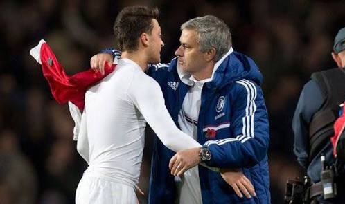 Ozil gives Mourinho a hug. And a shirt. 