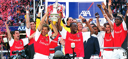 Tony Adams and Patrick Vieira lift the FA Cup together in 2002