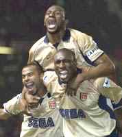 Paddy celebrates winning the Title and clinching the Double with Ashley Cole and Sol Campbell