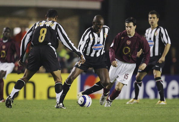 Vieira in the black and white stripes of Juventus with Arsenal's Cesc Fabregas