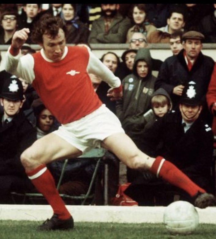 Bob is at full stretch to control the ball