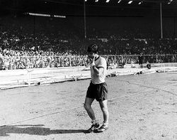 Malcolm walks off the Wembley pitch after losing a third major Cup Final