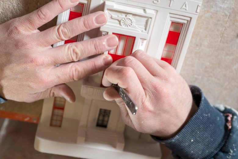 Putting finishing touches to a Highbury sculpture