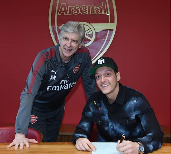 Ozil signs