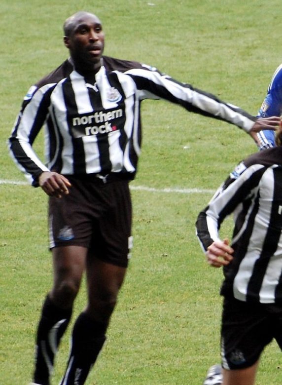 Sol wearing the black and white shirt of Newcastle United