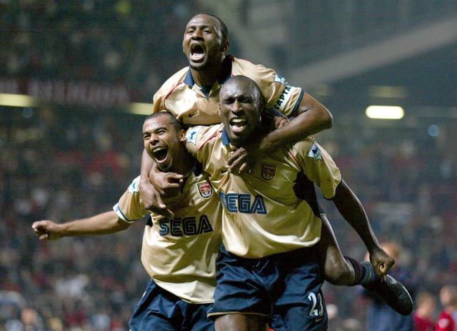 Sol celebrates winning the title at Old Trafford with Patrick Vieira and Ashley Cole